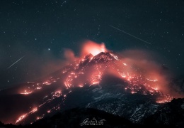 Stars over an Erupting Volcano